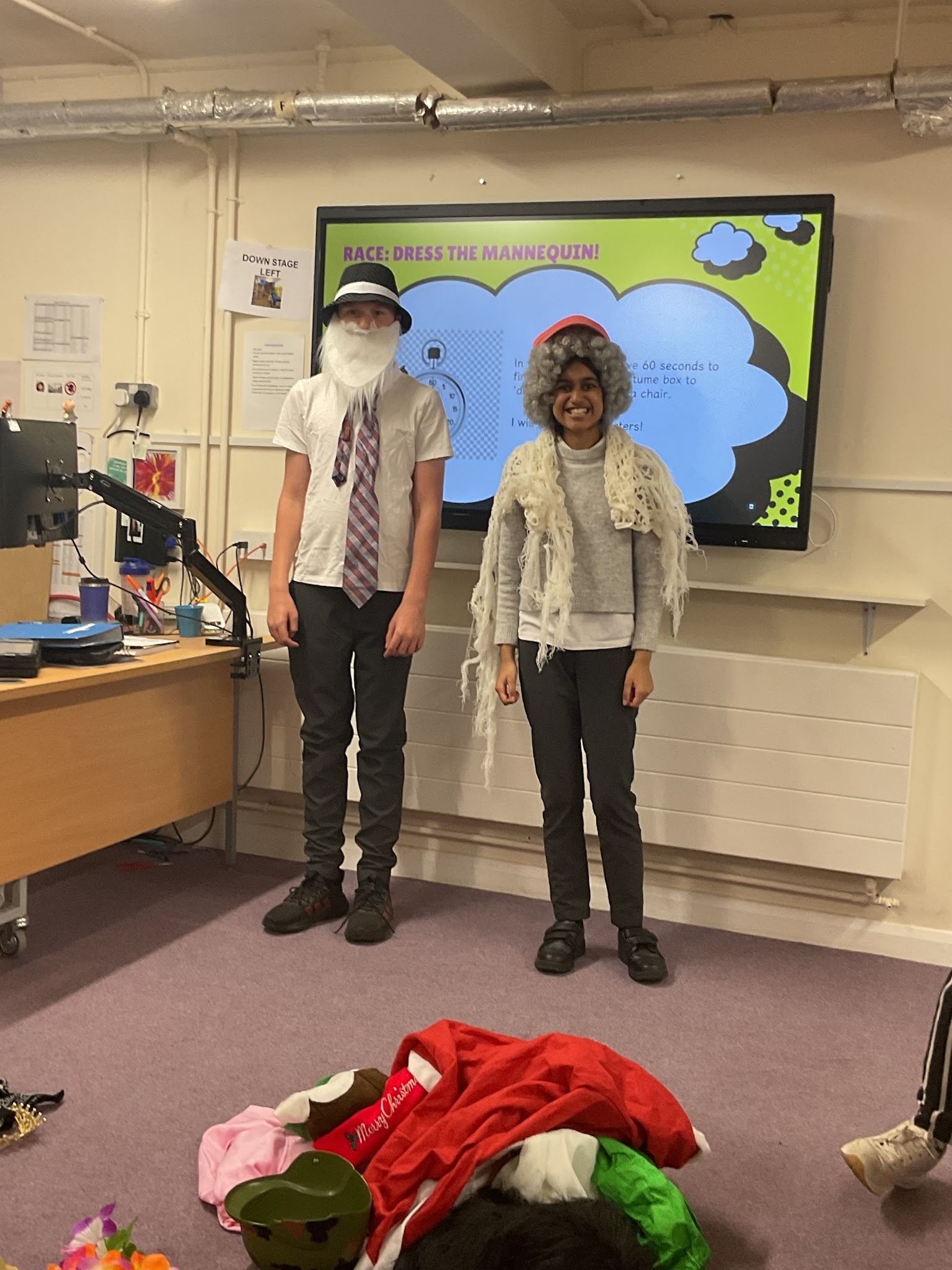 A boy and a girl from Earth class dressed in costume and smiling