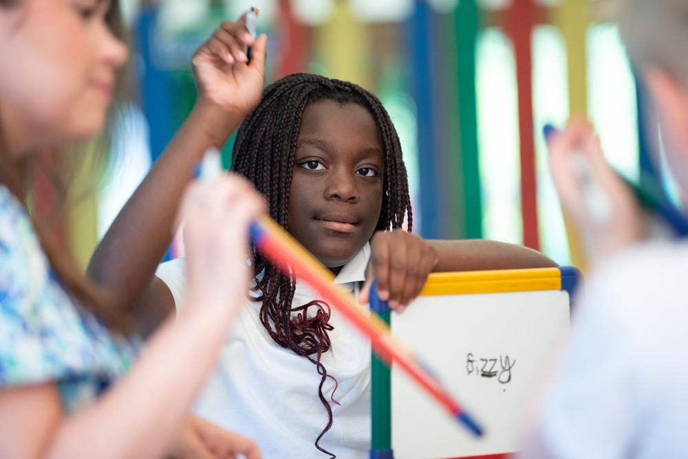 Student writing outside Student writing outside