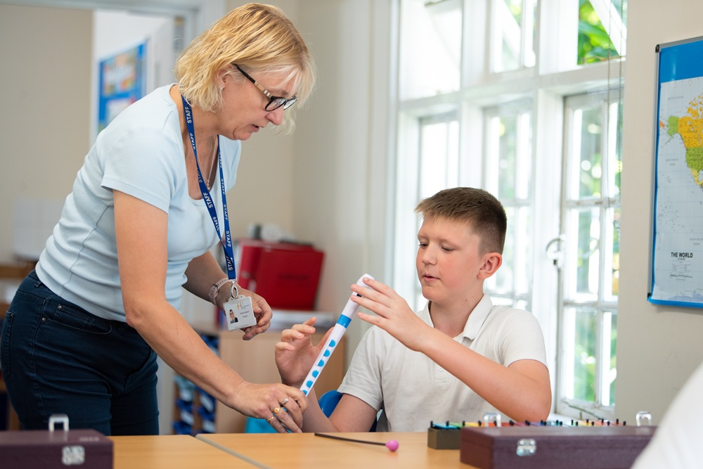 Music teacher and student with recorder Music teacher and student with recorder