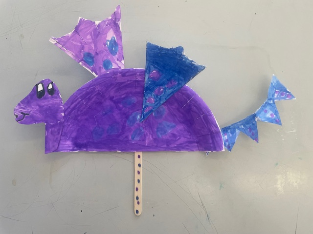 A purple dragon created by an Apple student
