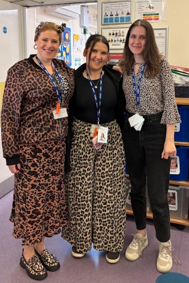 Three members of staff wearing leopard print