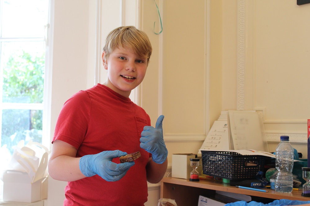 Student serving cake