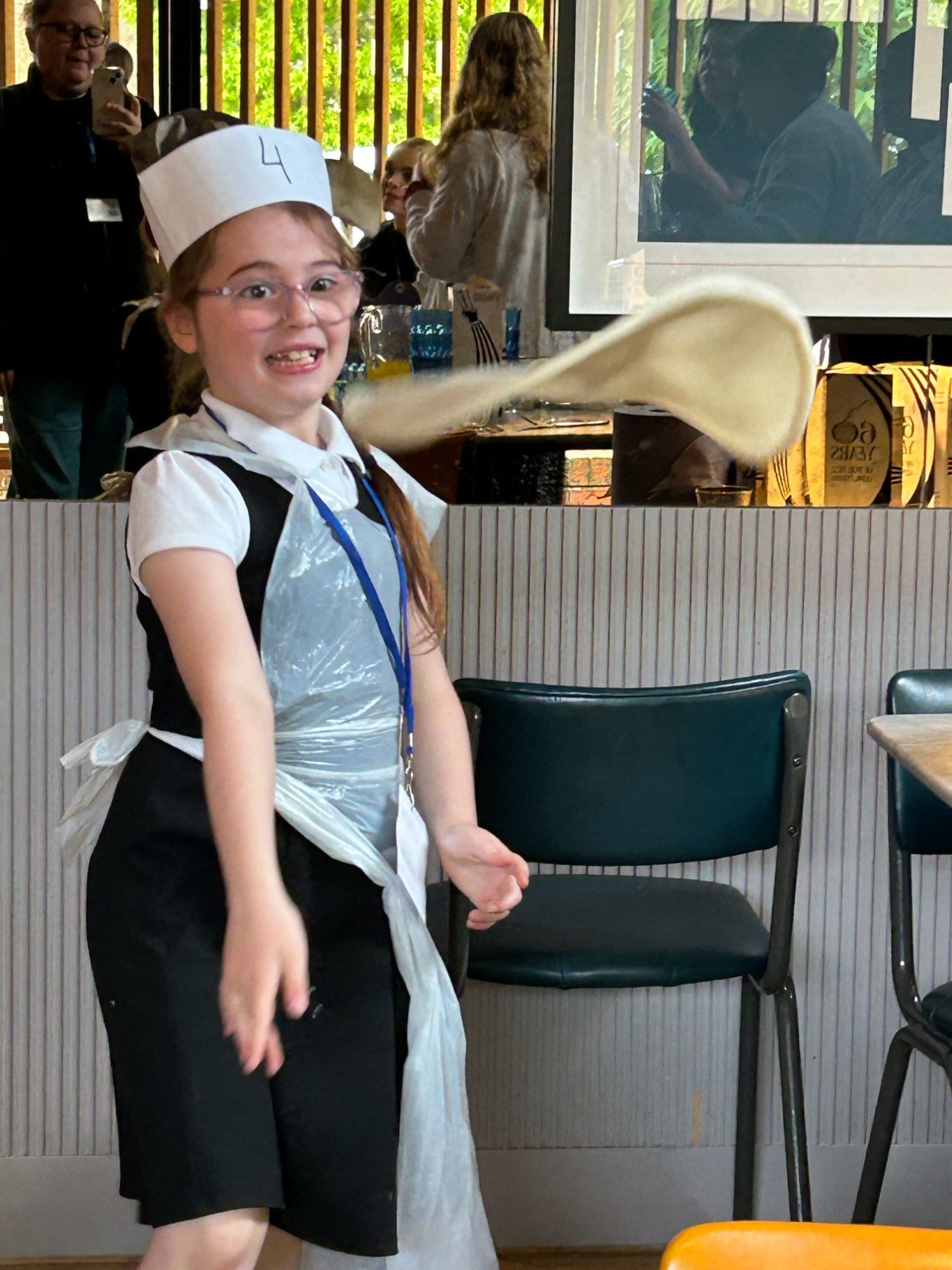 Girl throwing a pizza