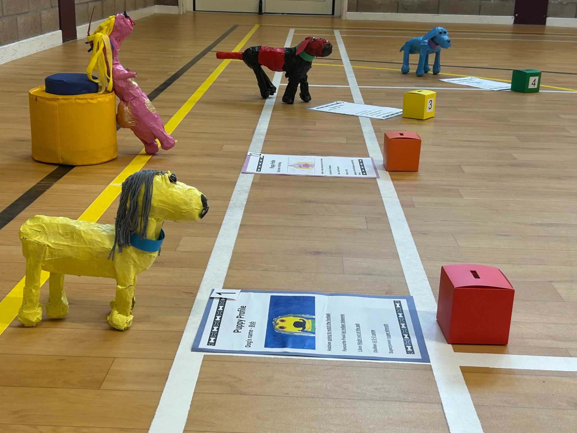 Paper mache dogs displayed in the Sports Hall