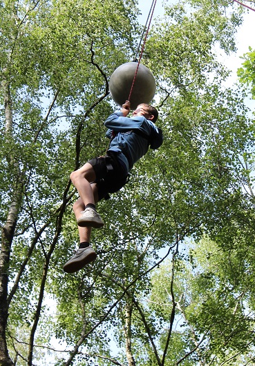 Student leaping in harness