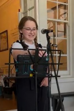 Lily about to sing at her musical showcase