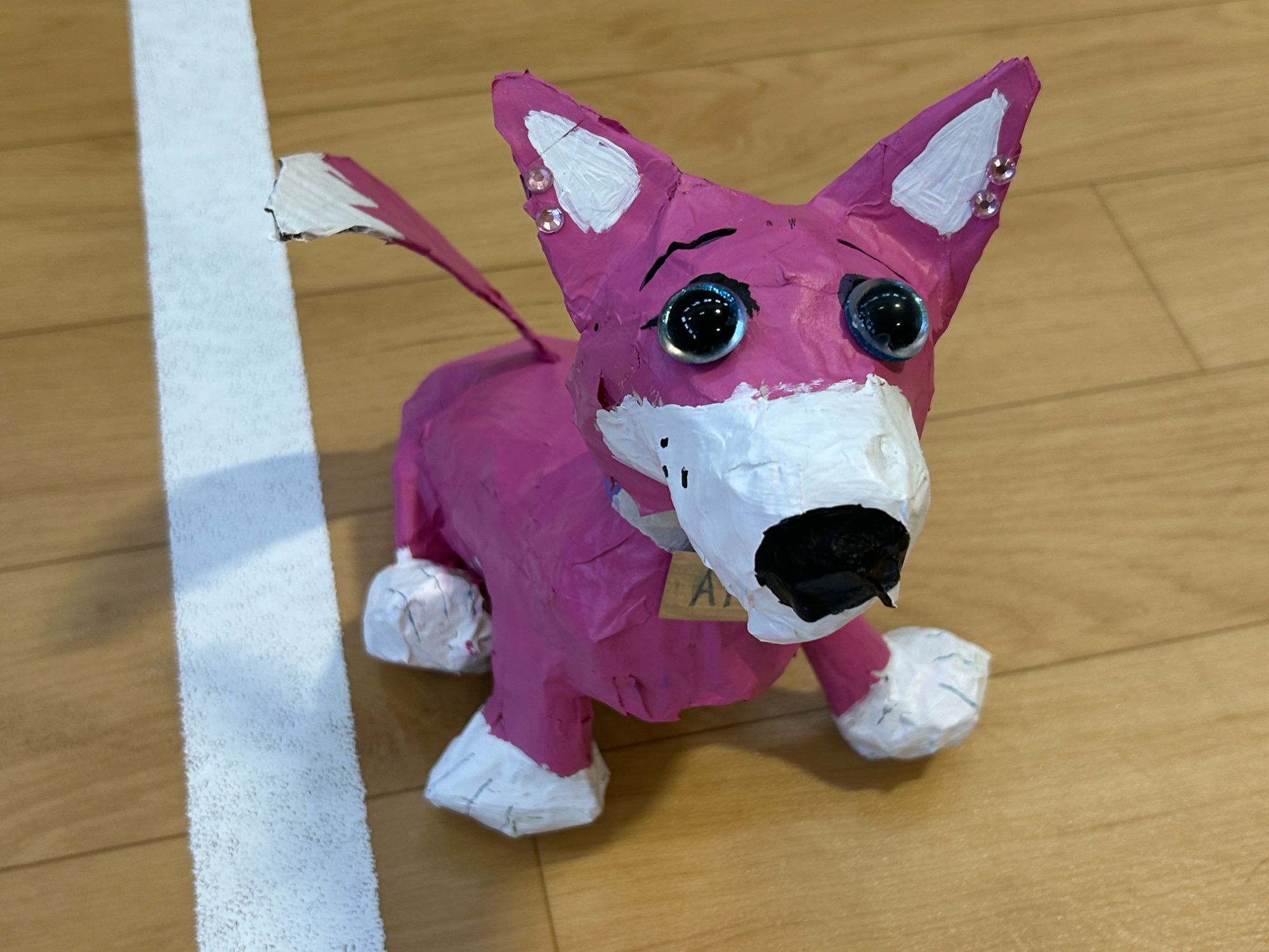Pink paper mache dog