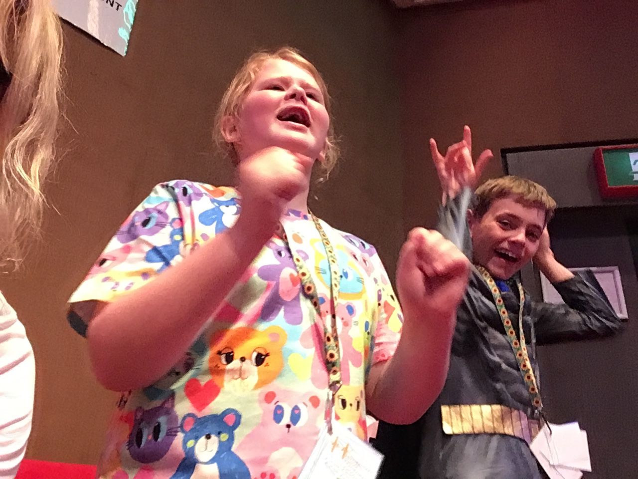 Two students singing and dancing