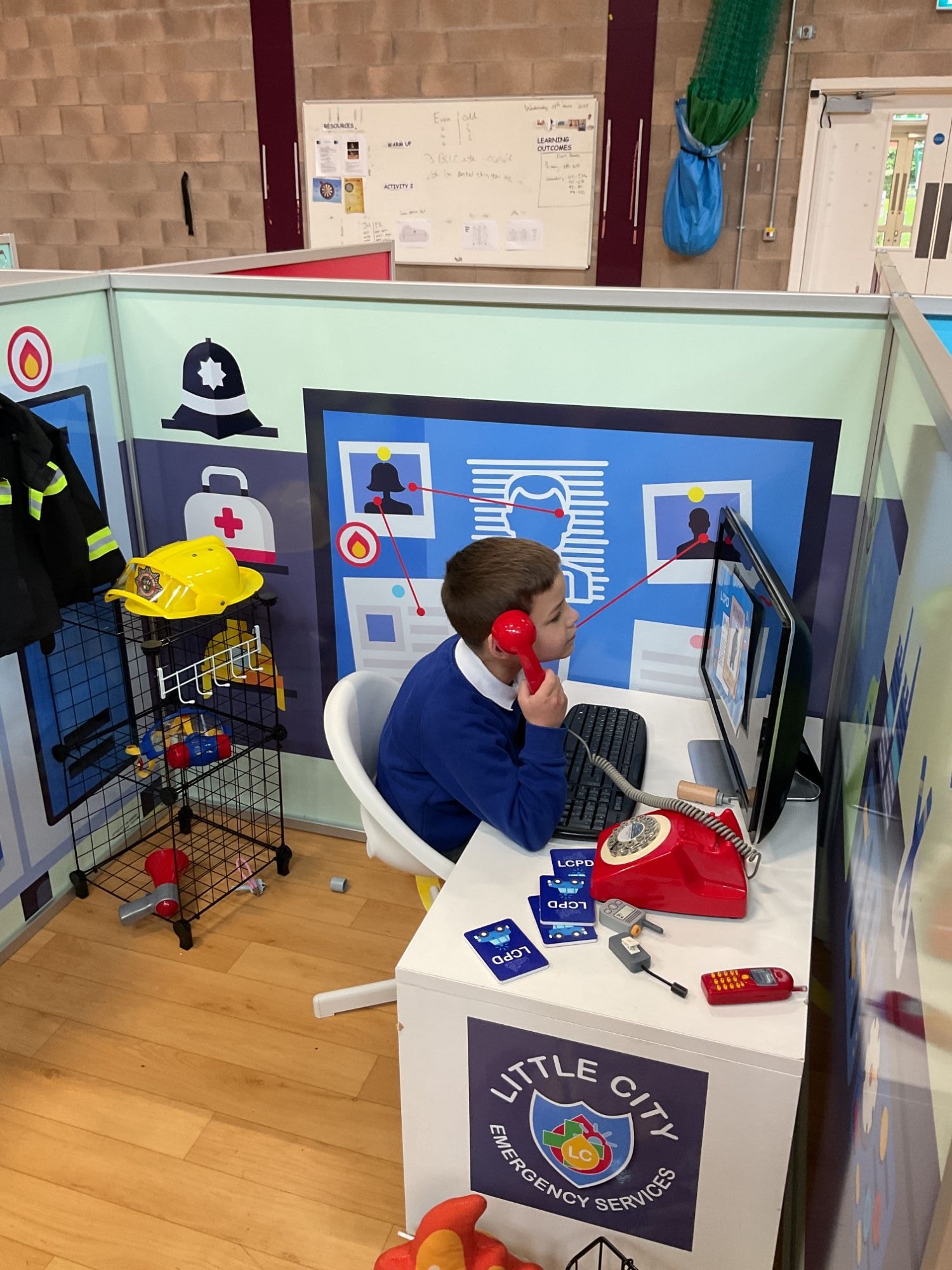 Manning the phone at the police station