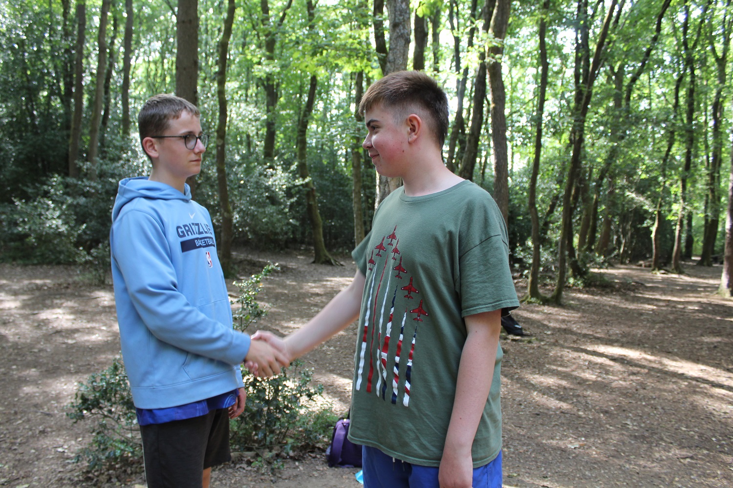 Two students shaking hands