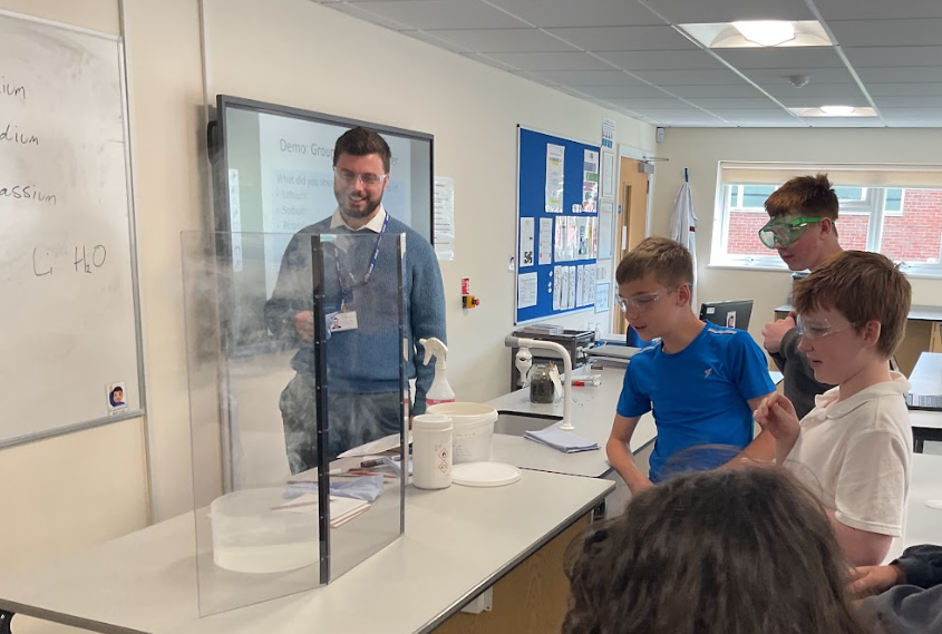 Mecury class watching a science experiment