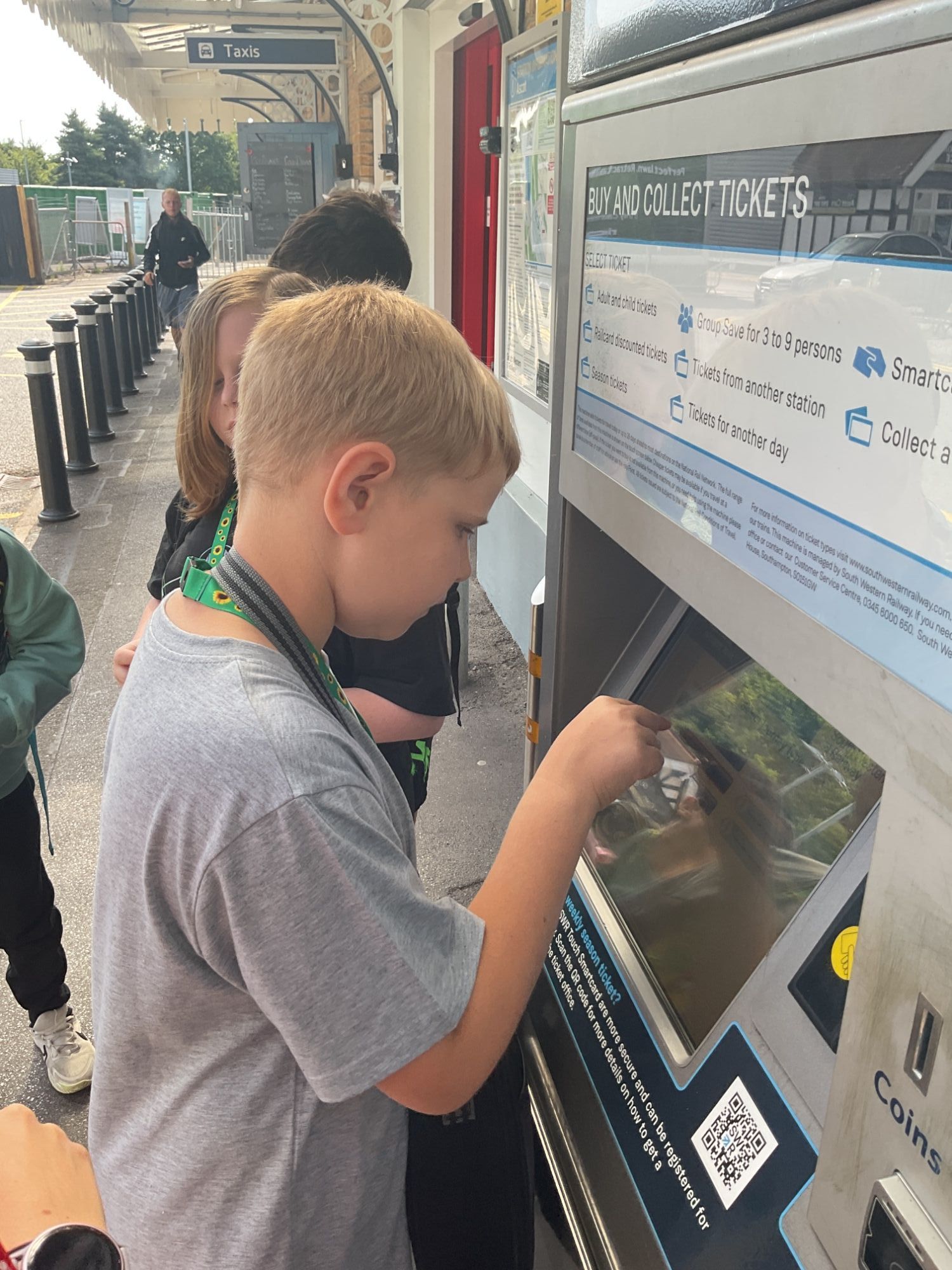 Elm student buying a train ticket