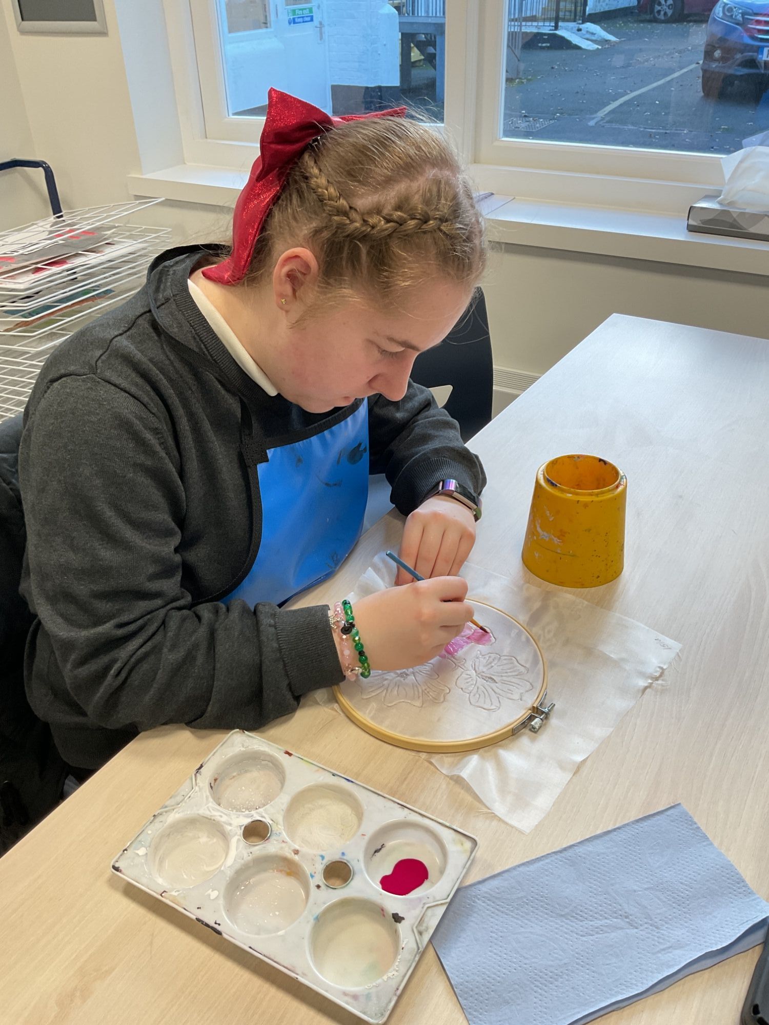 Year 10 girl painting on silk