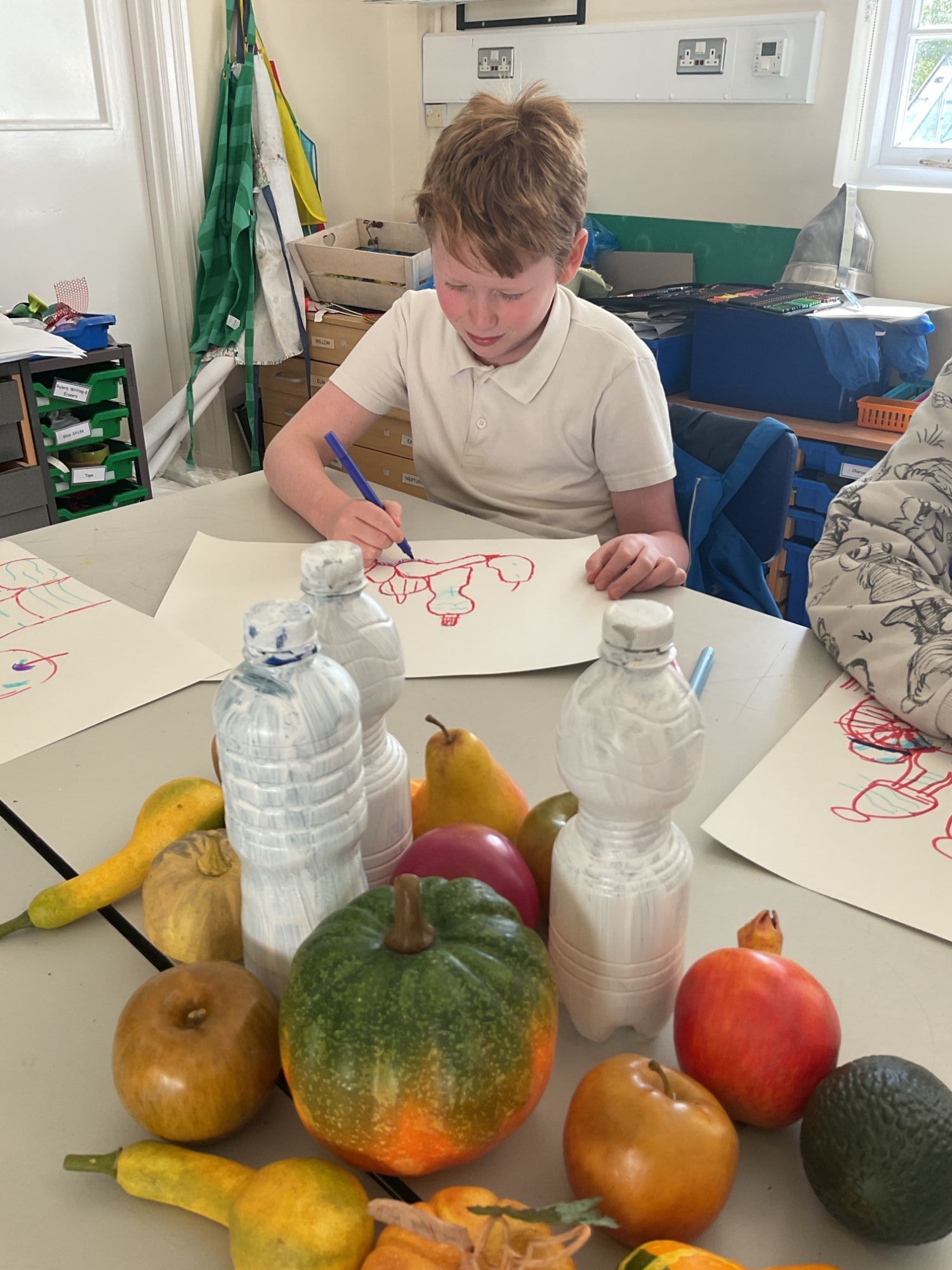 Elm student drawing his still life