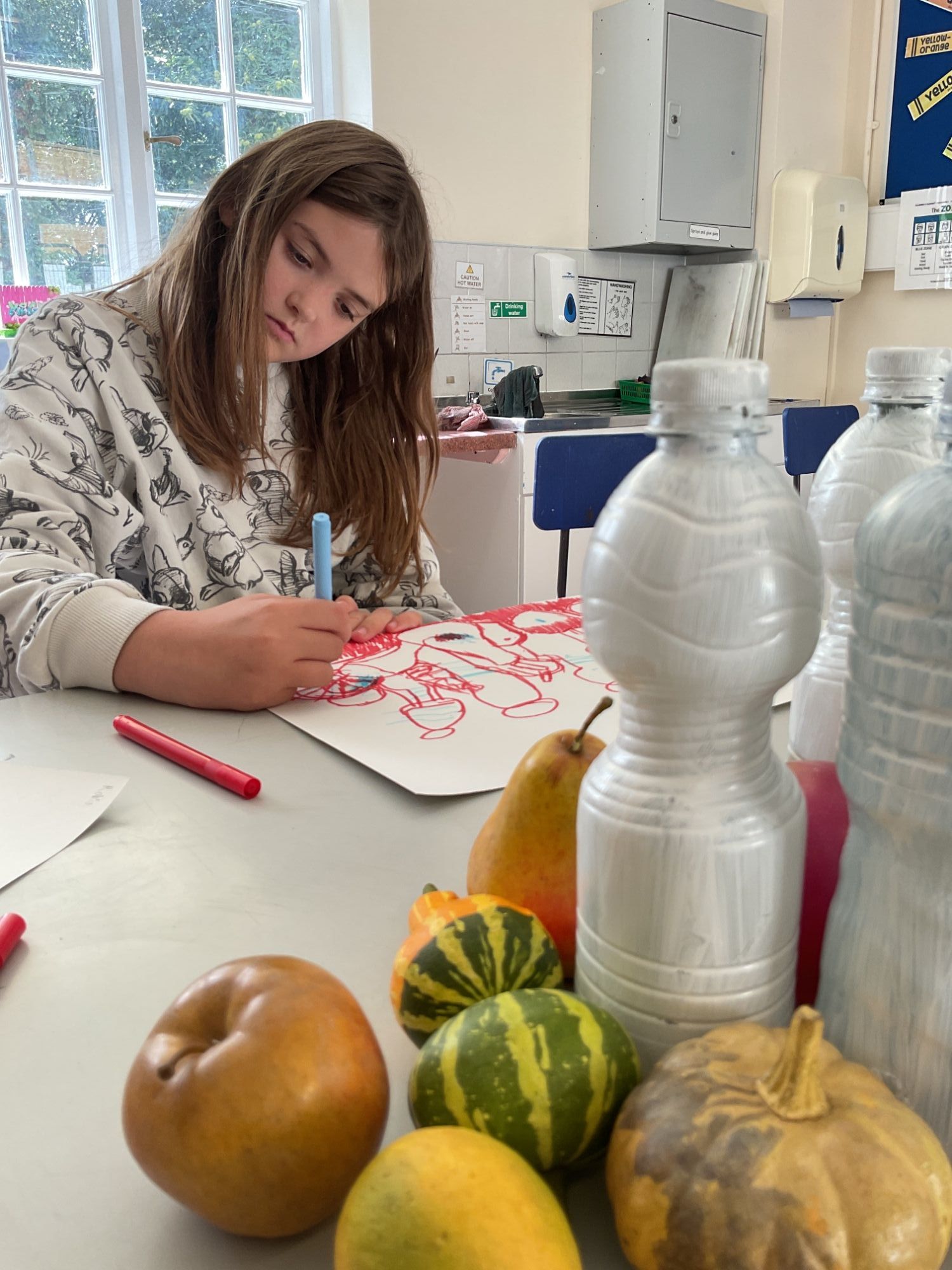 Elm student drawing her still life