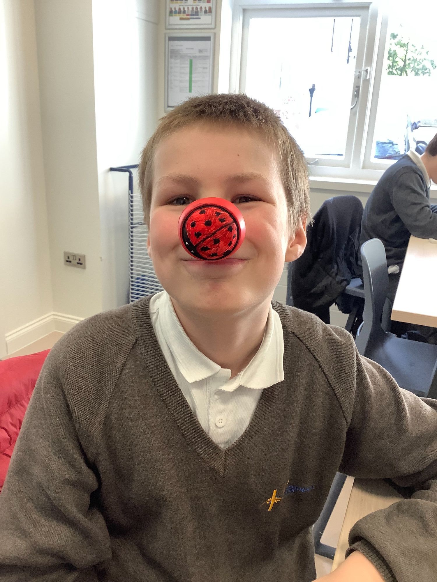 Boy wearing his red nose