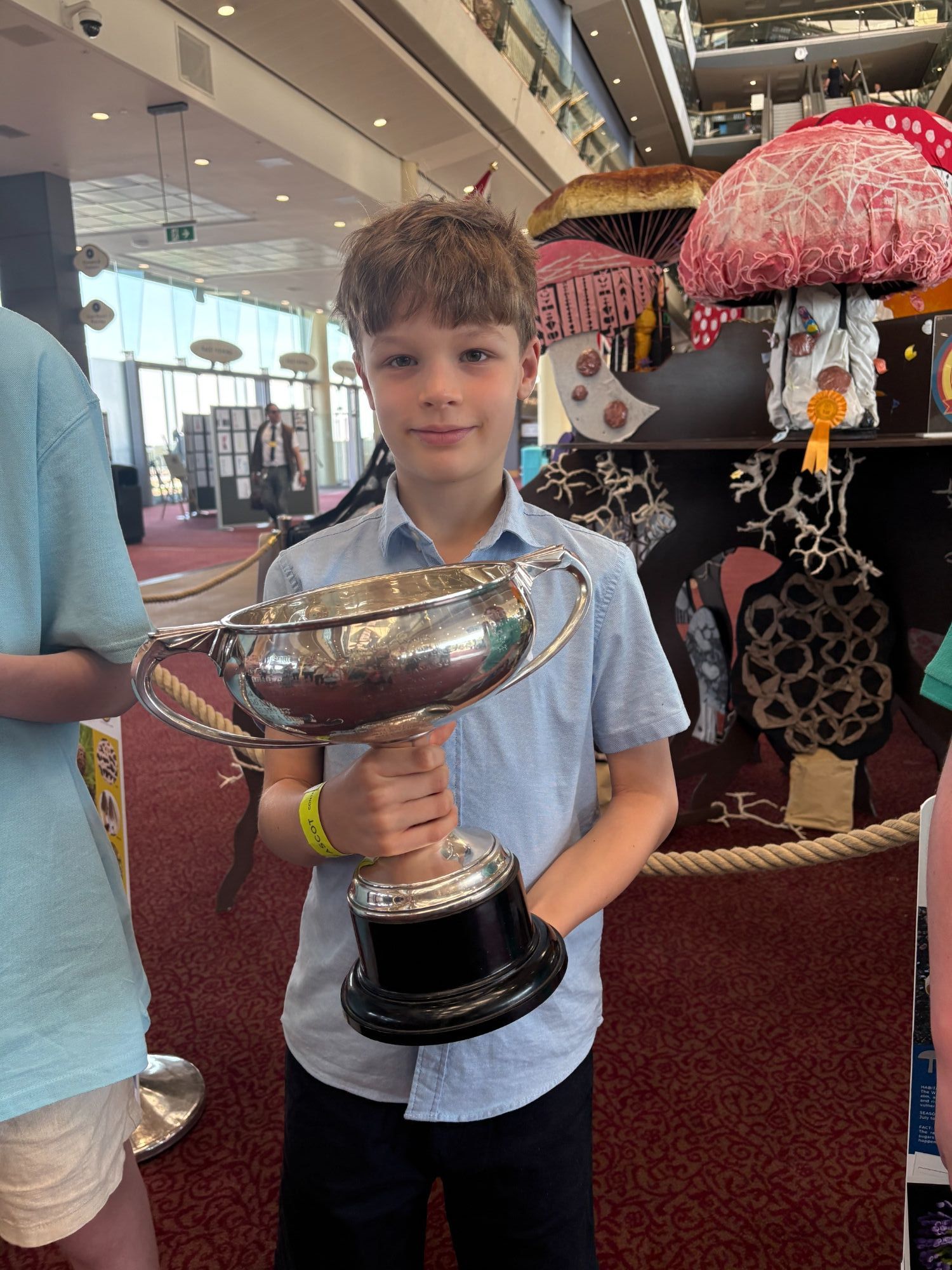 Student holdinf the trophy