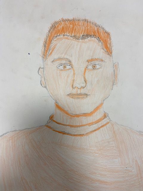 Self portrait of a boy drawn in orange pencil