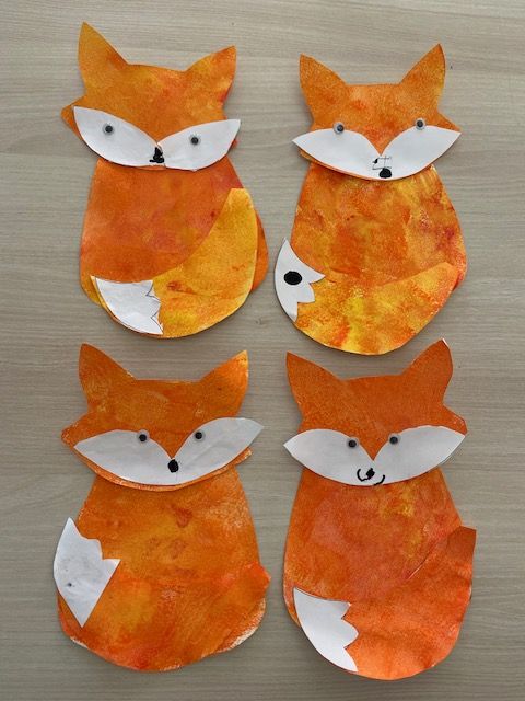 Four bright orange foxes painted by Cherry Class
