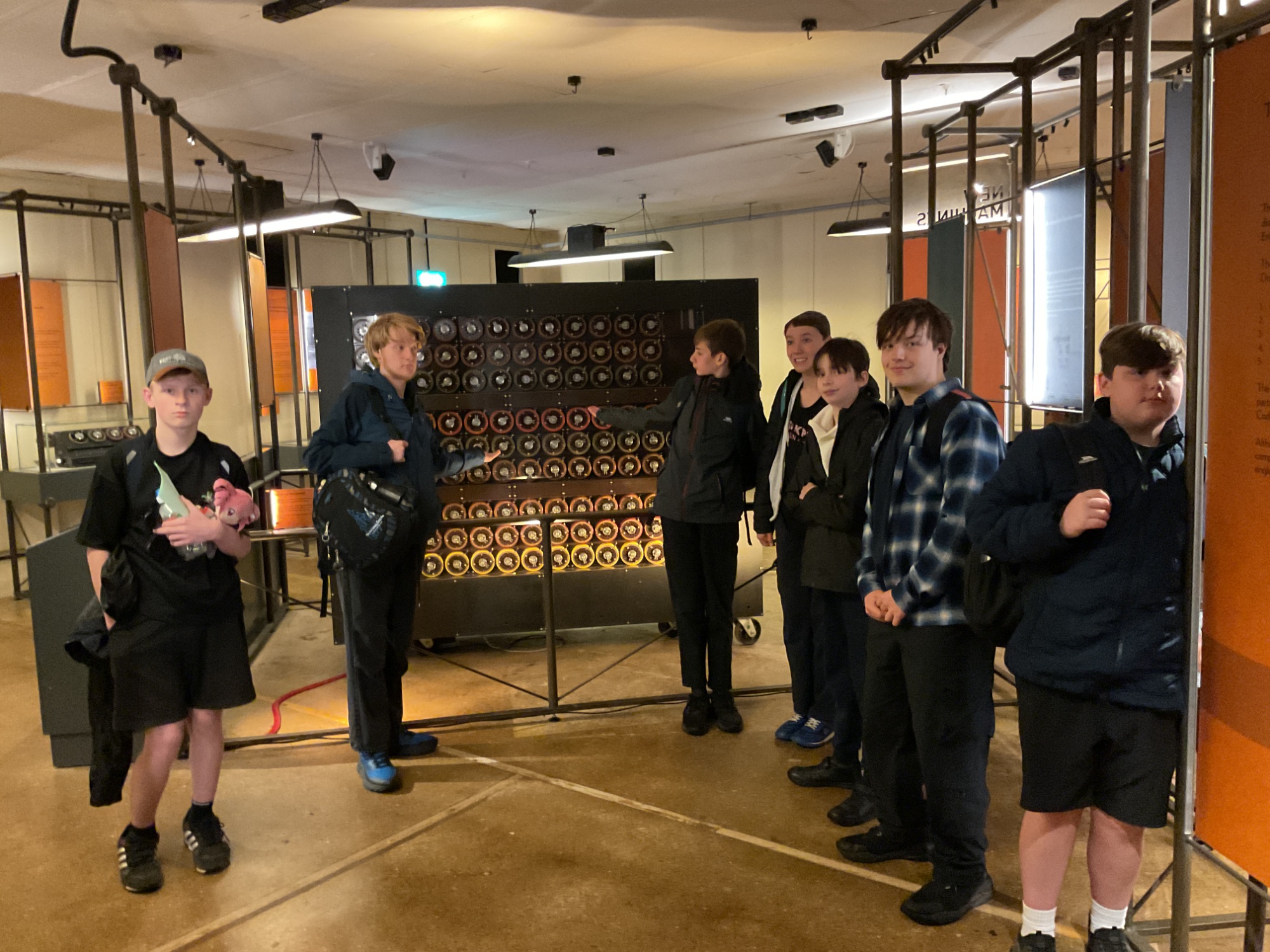 Group shot of students in front of an exhibit at the museum