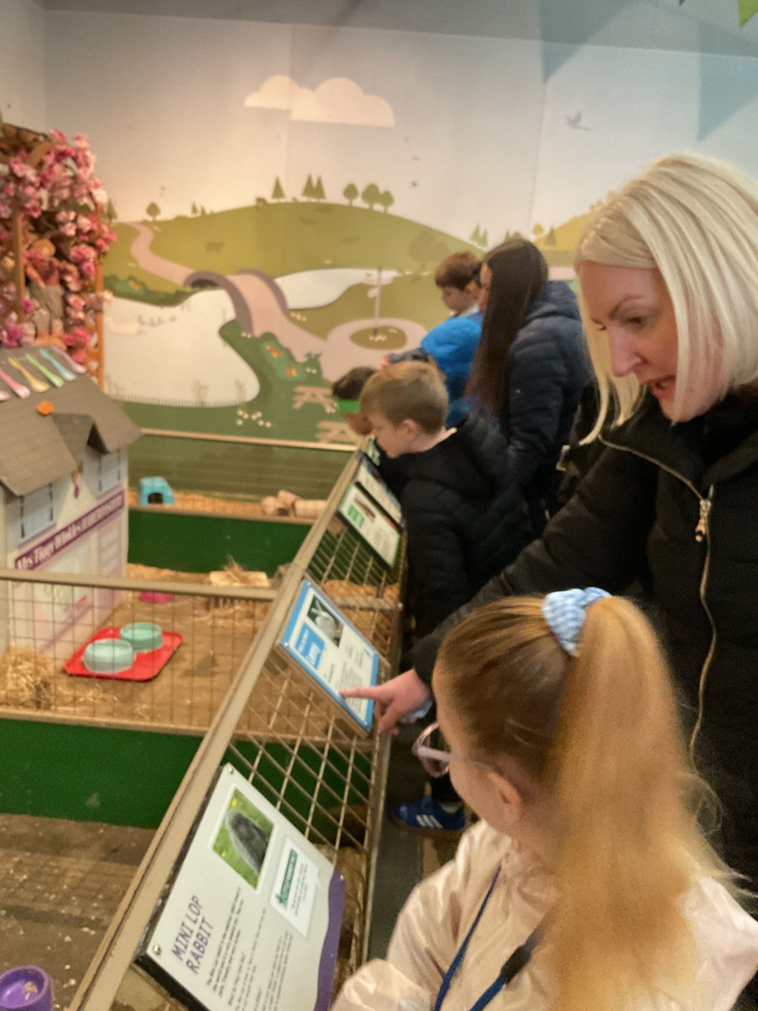 Girl and TA learning about small animals