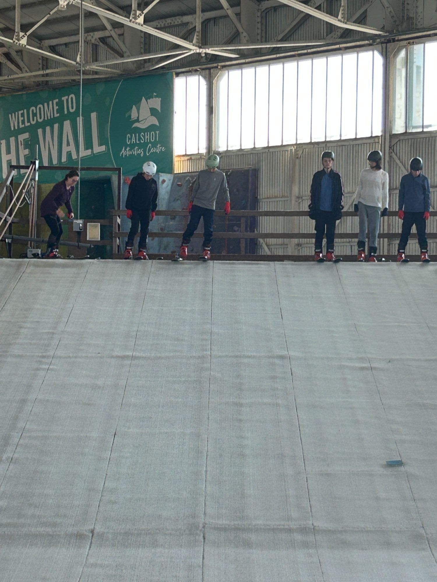 Students stood at the top of the ski slope waiting to come down