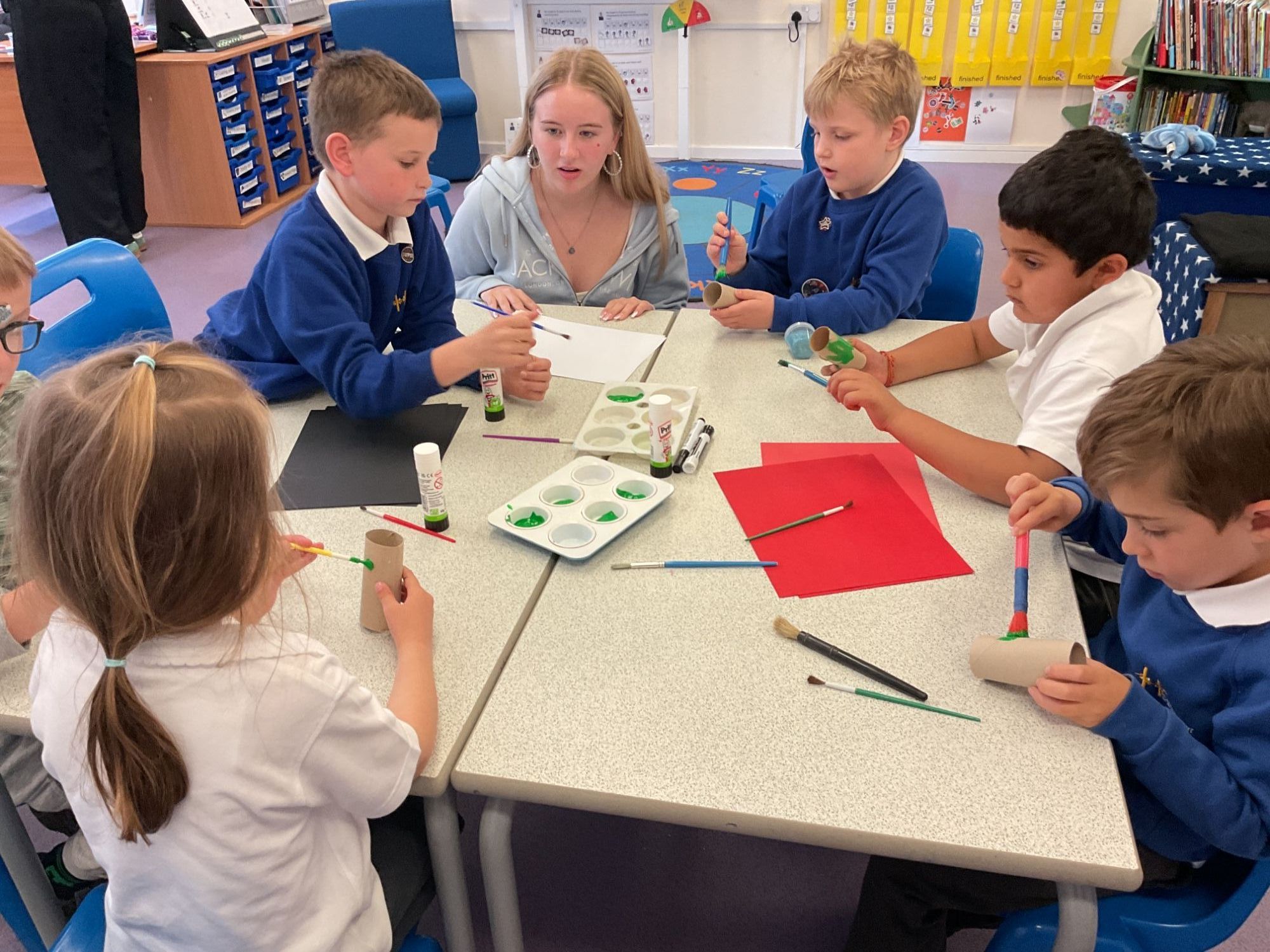 Student helping foundation students with their craft