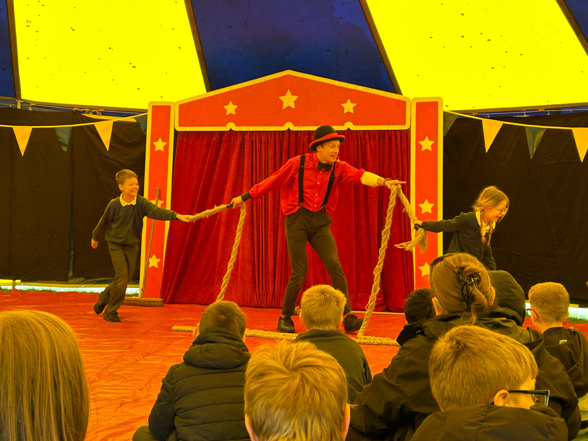 Two students colunteering for a rope trick