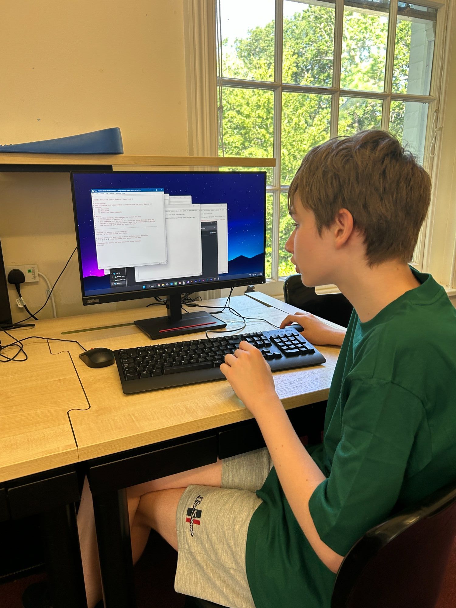 Student using a coding program on a computer