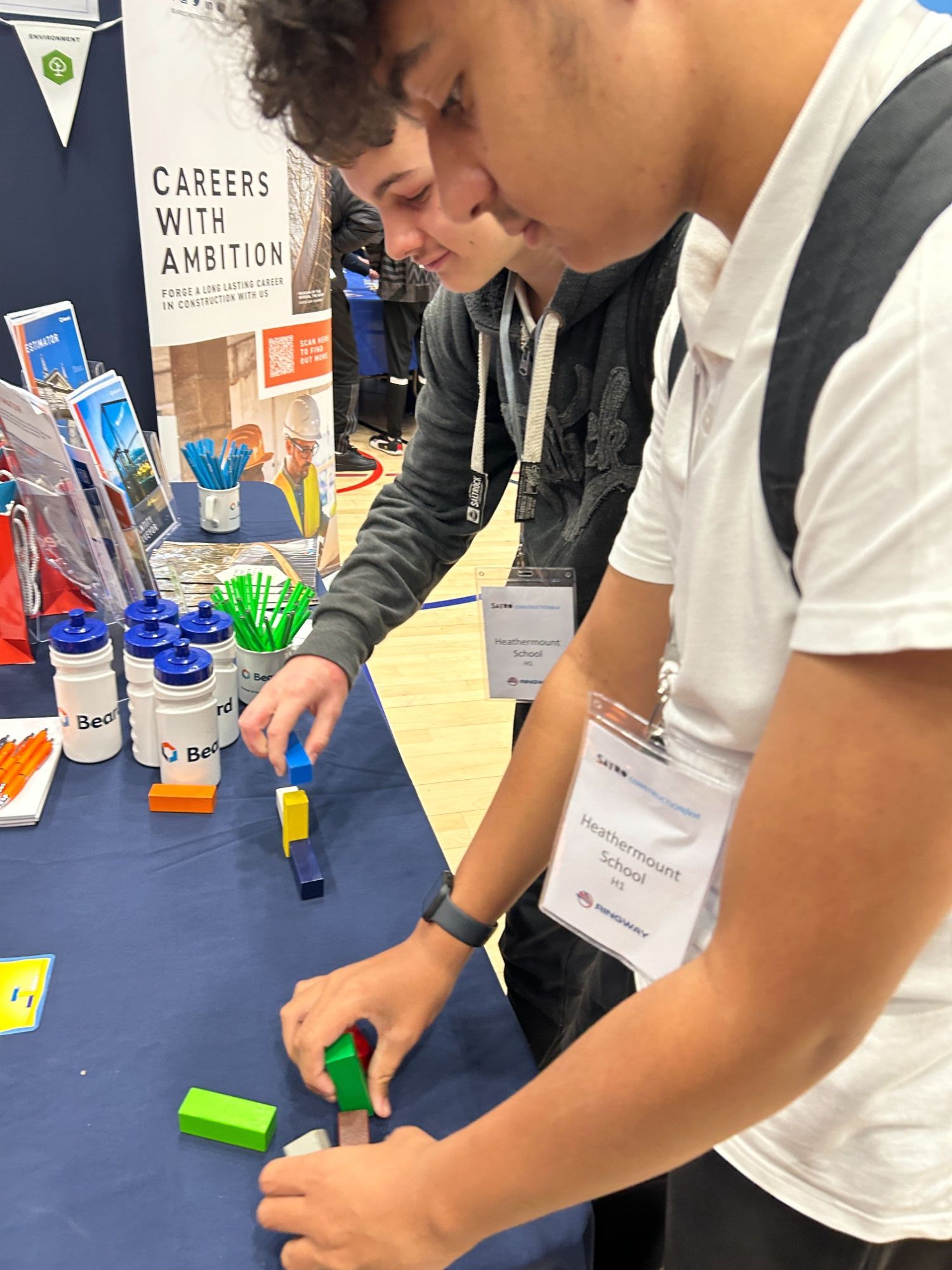 Two students engaging with a stall at ConstructionFest