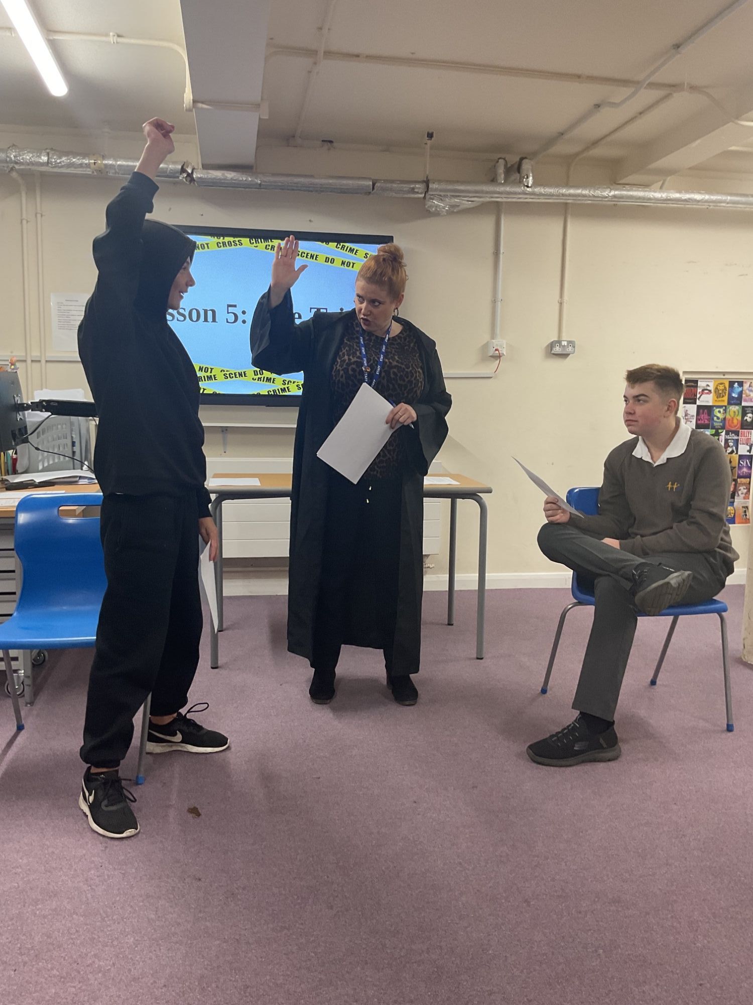 Boys from Mercury acting out a trial with their teacher 1