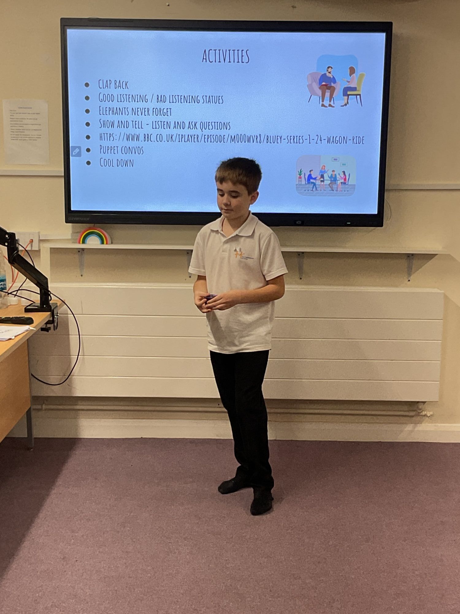 Boy from Oak presenting in front of the screen