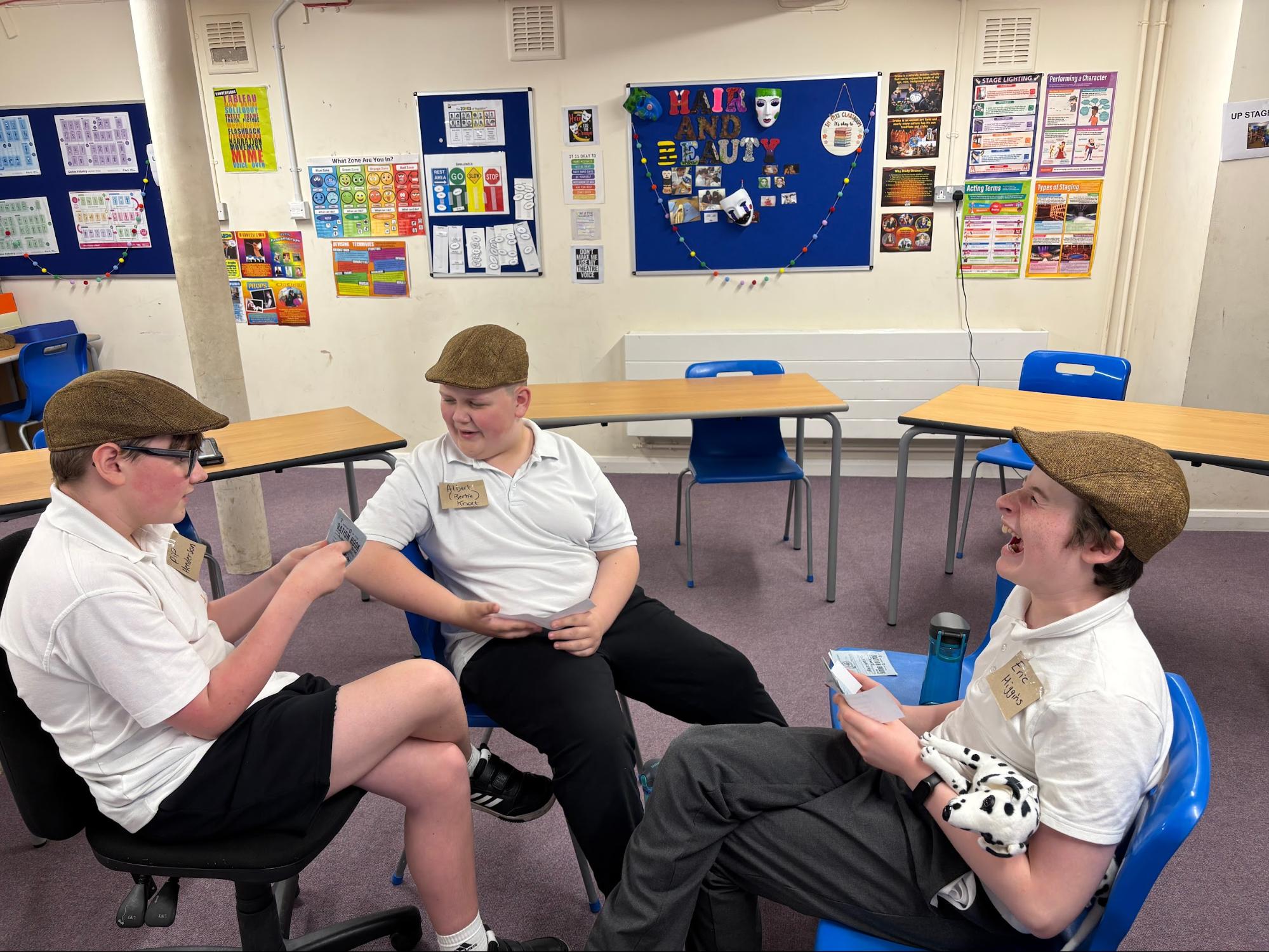 3 boys in flat caps taking on evacuee characters