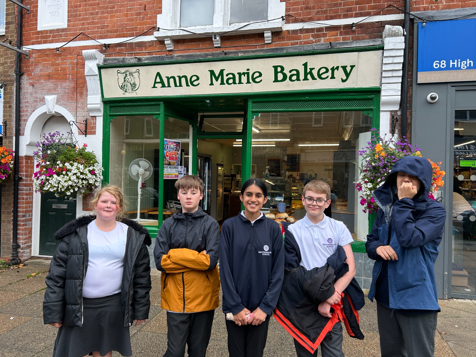 Stars students outside the local bakery