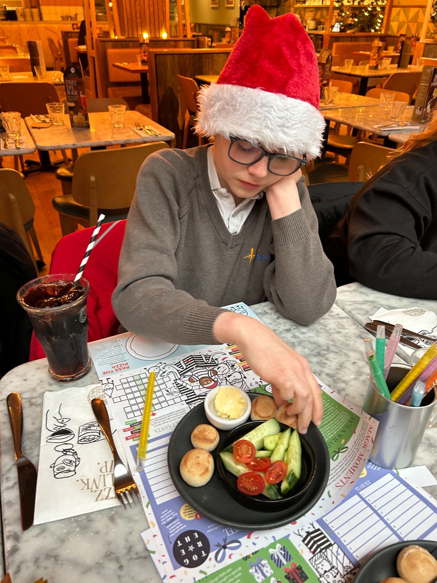 Boy with his dough balls and salad items