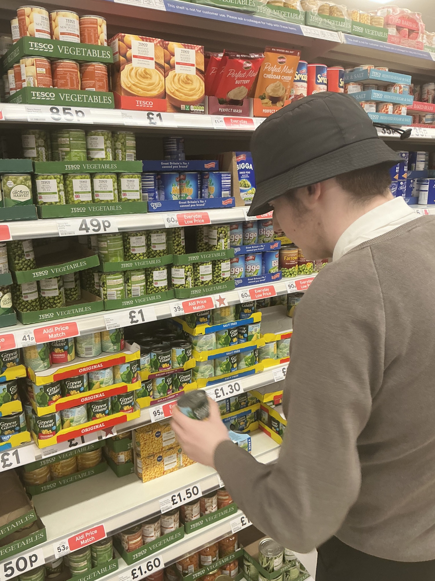 Student selecting items for his recipe 