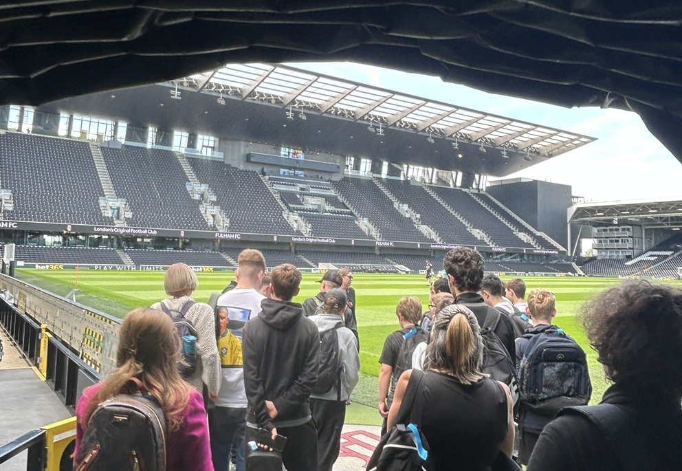 Students walking through to the pitch