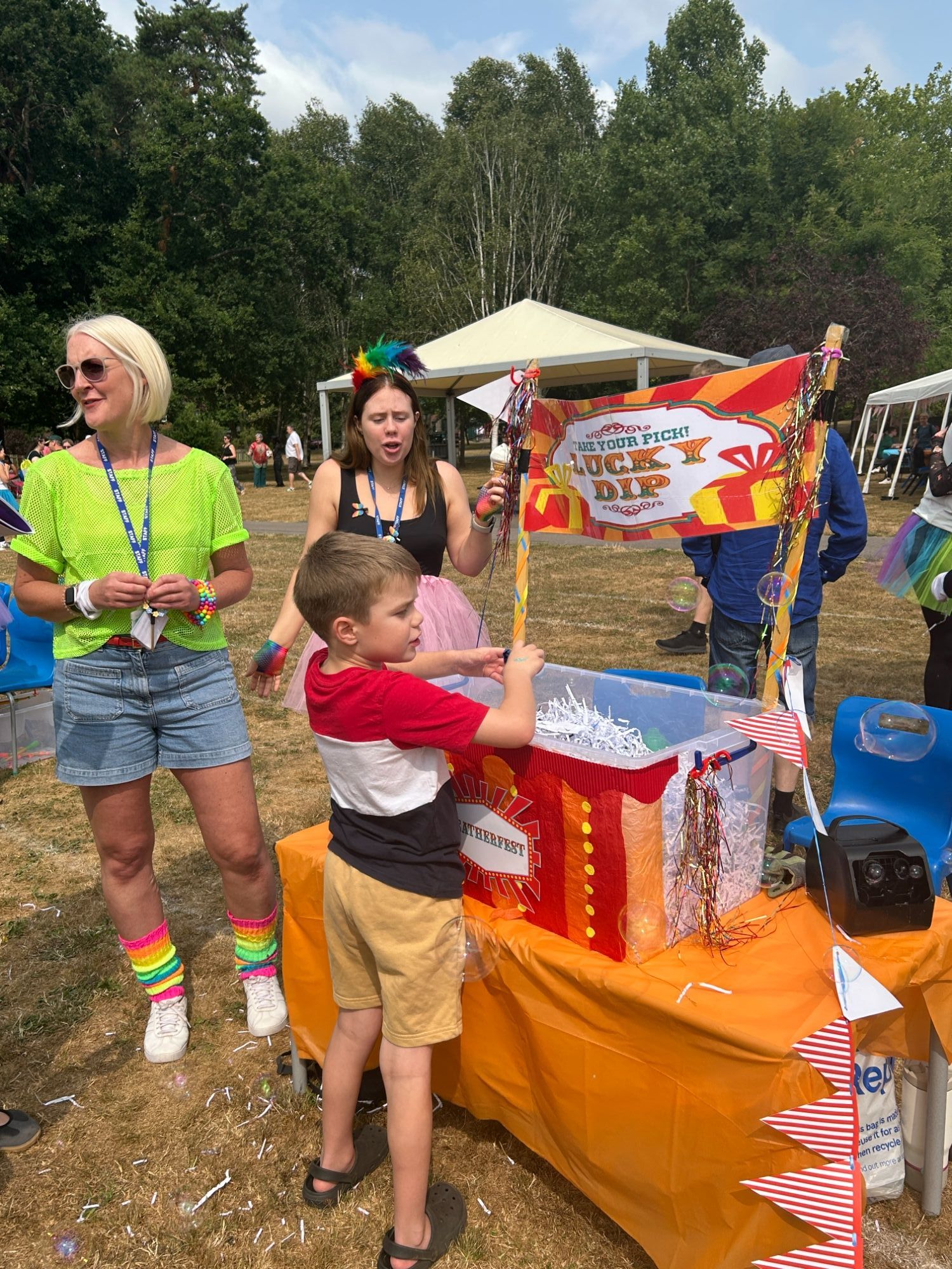 Boy having a go at the lucky dip stall