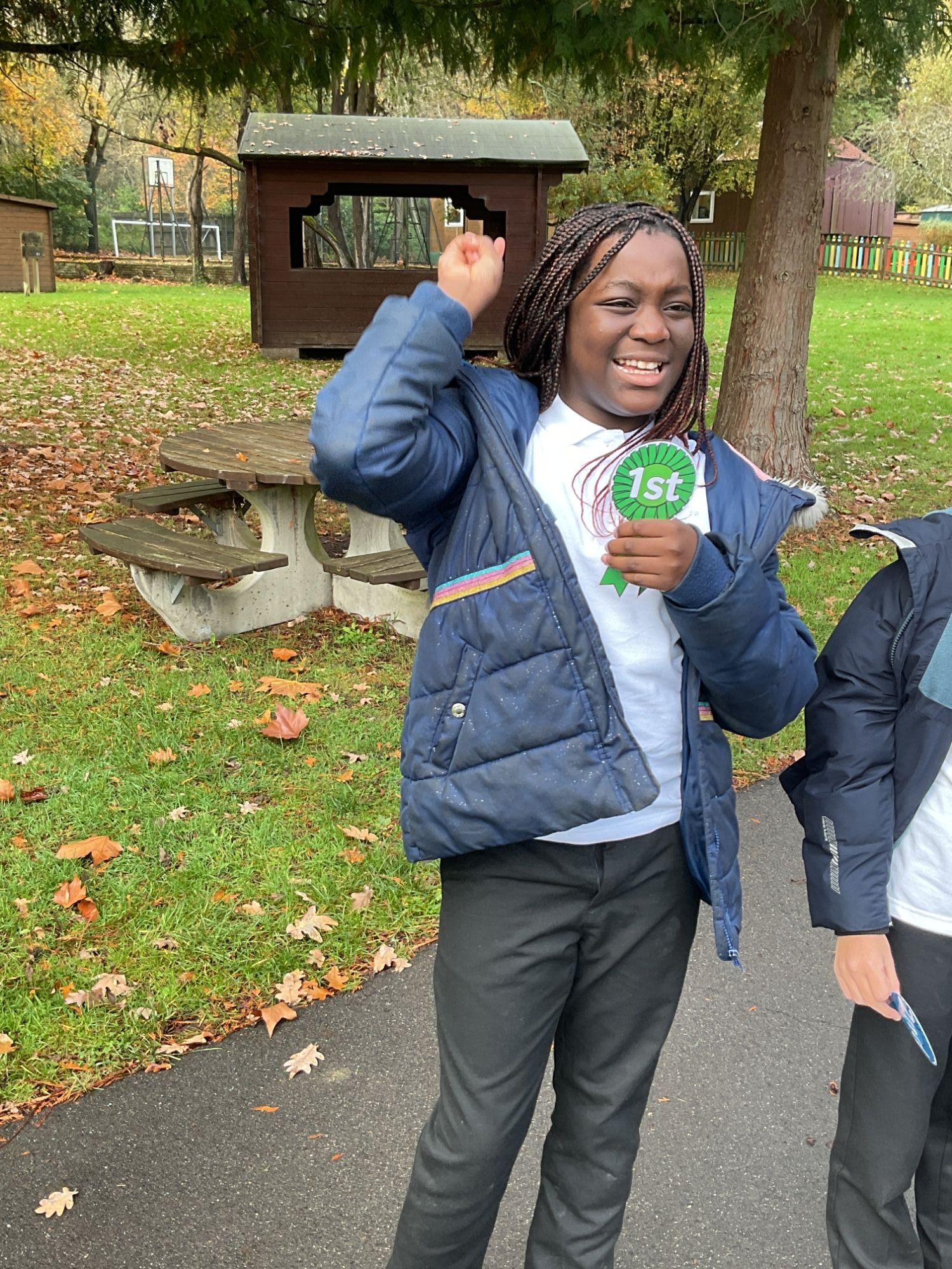 Student smiling with her 1st place rosette