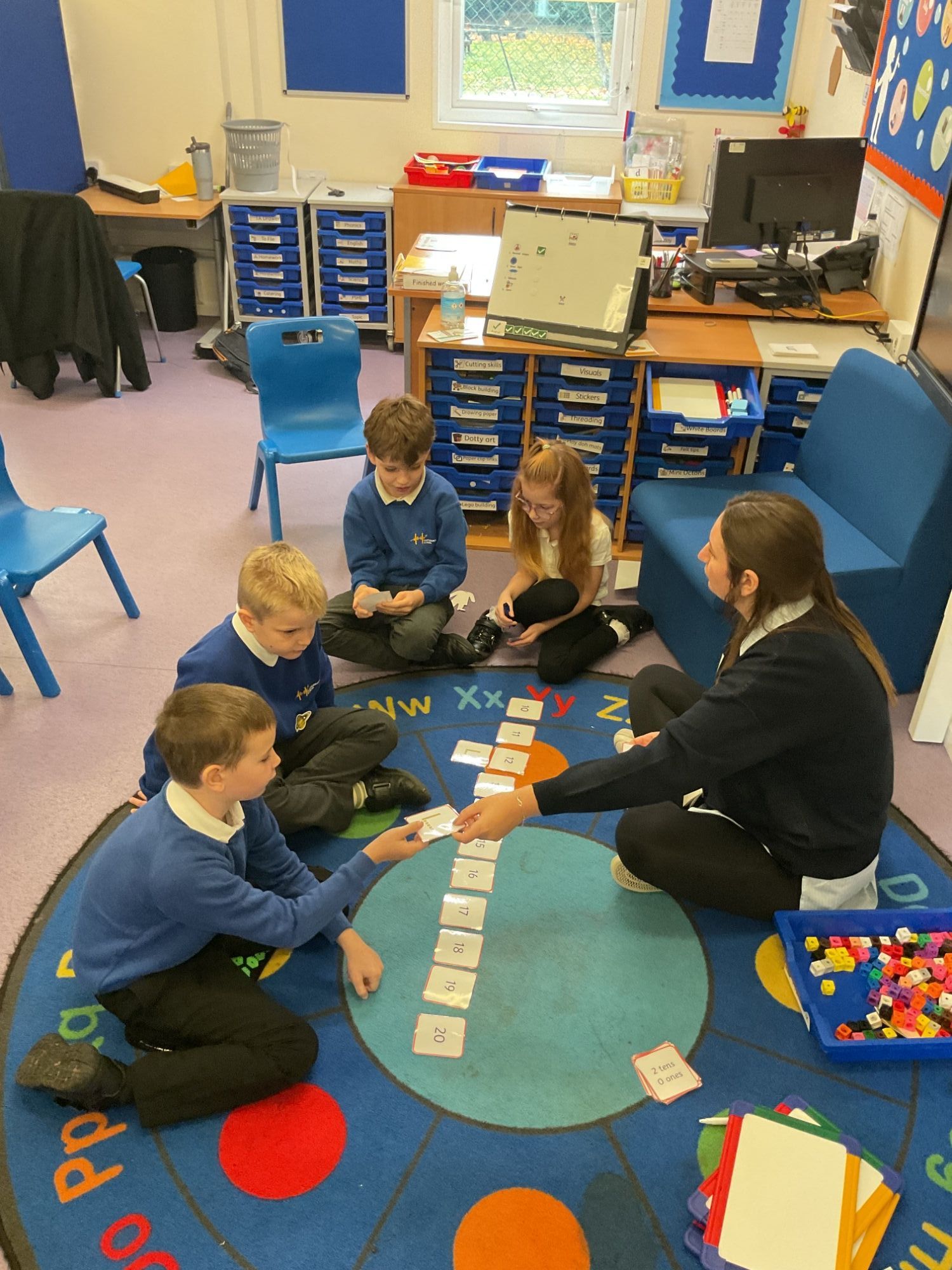 Apple class using a number line on the carpet