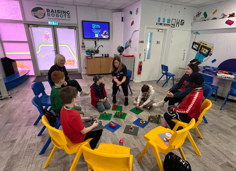 Lego workshop Students listening to the instructor at the lego workshop