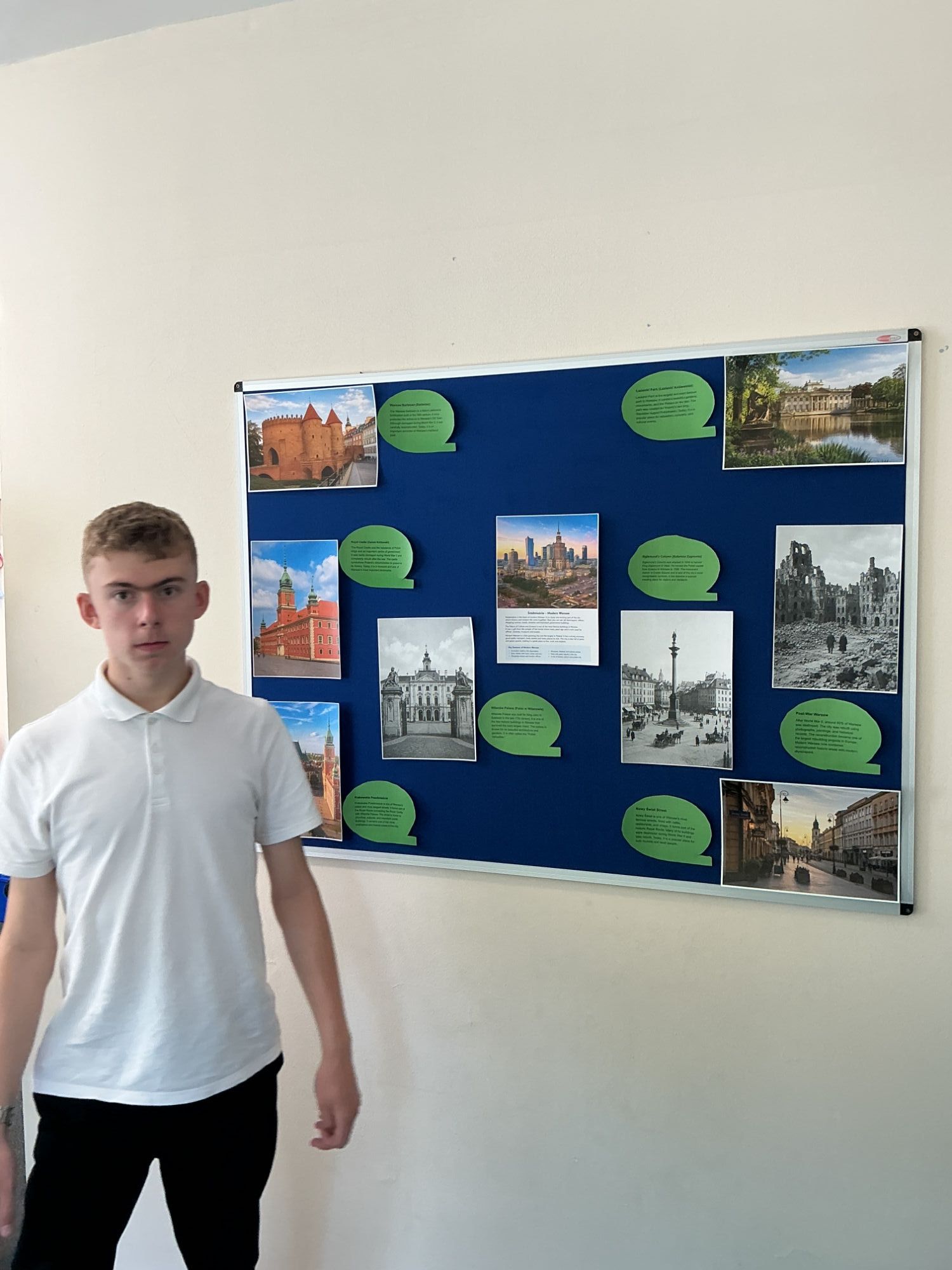 Boy 4 by the Warsaw display board