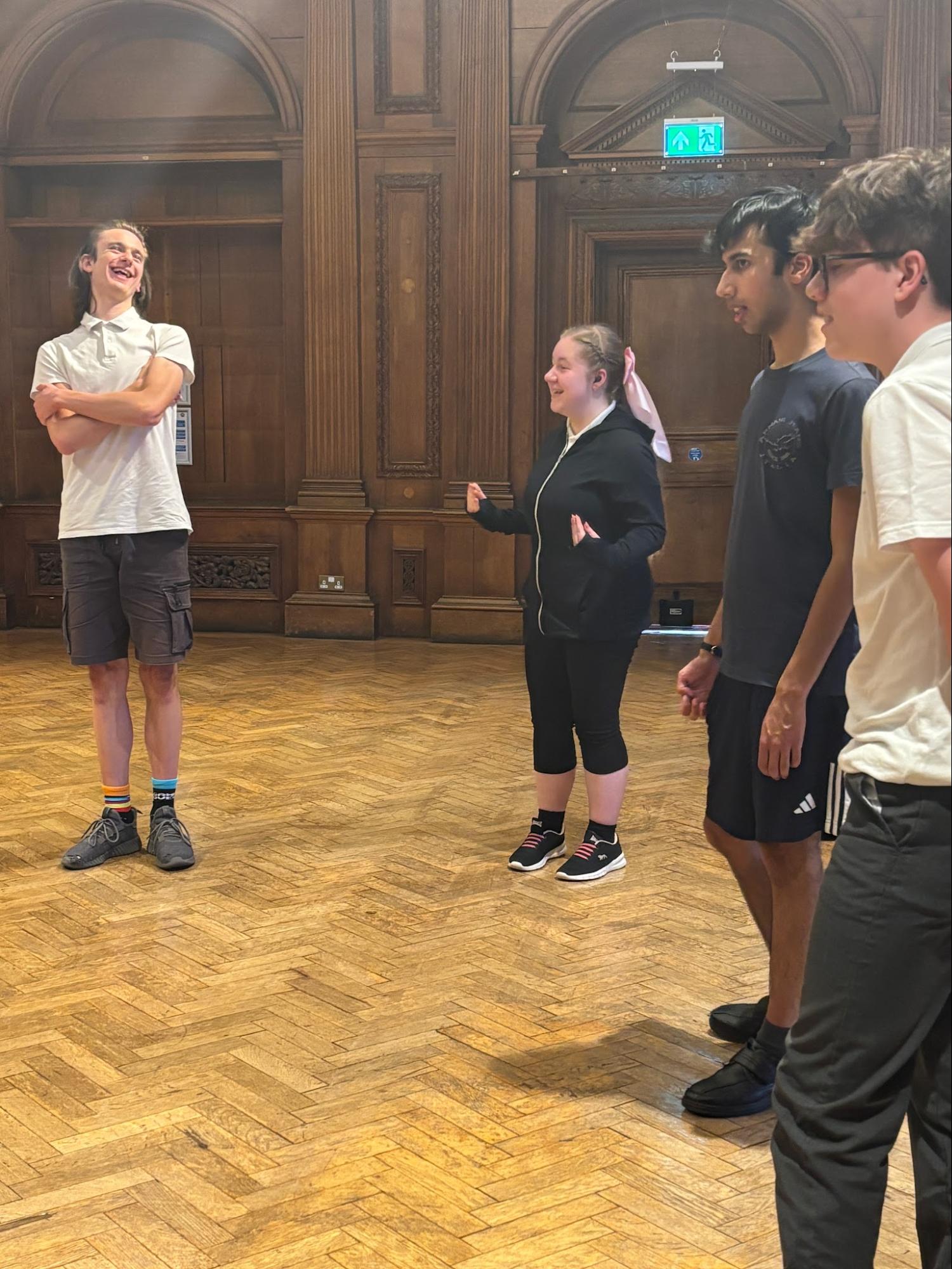 Students stood up taking part in a workshop