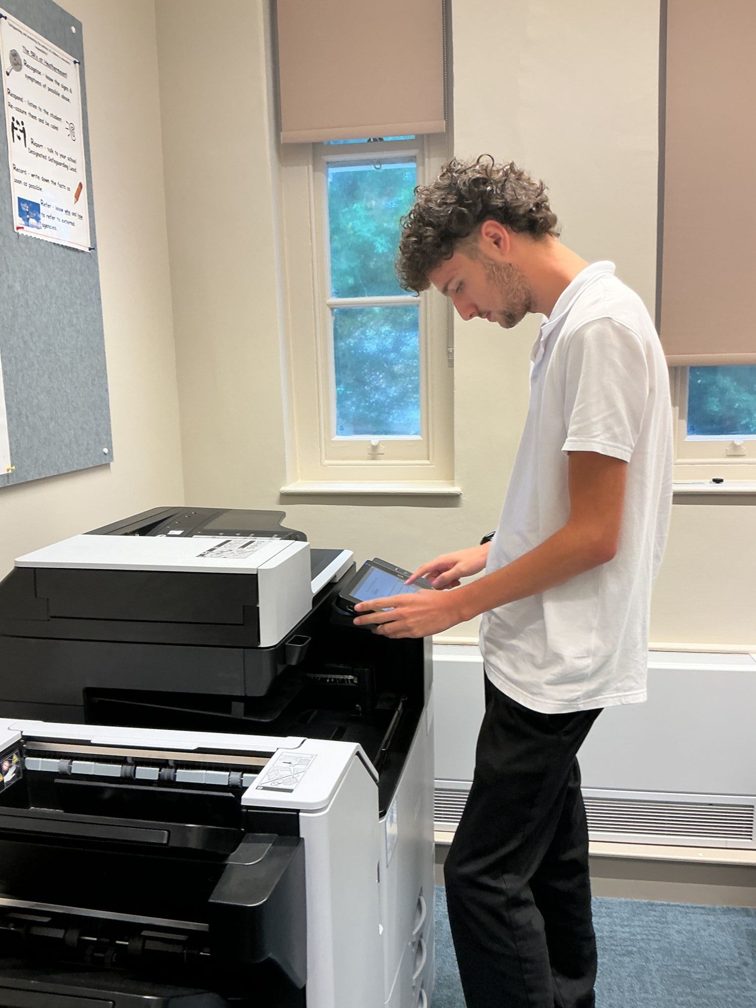 Student using the photocopier in the school production room