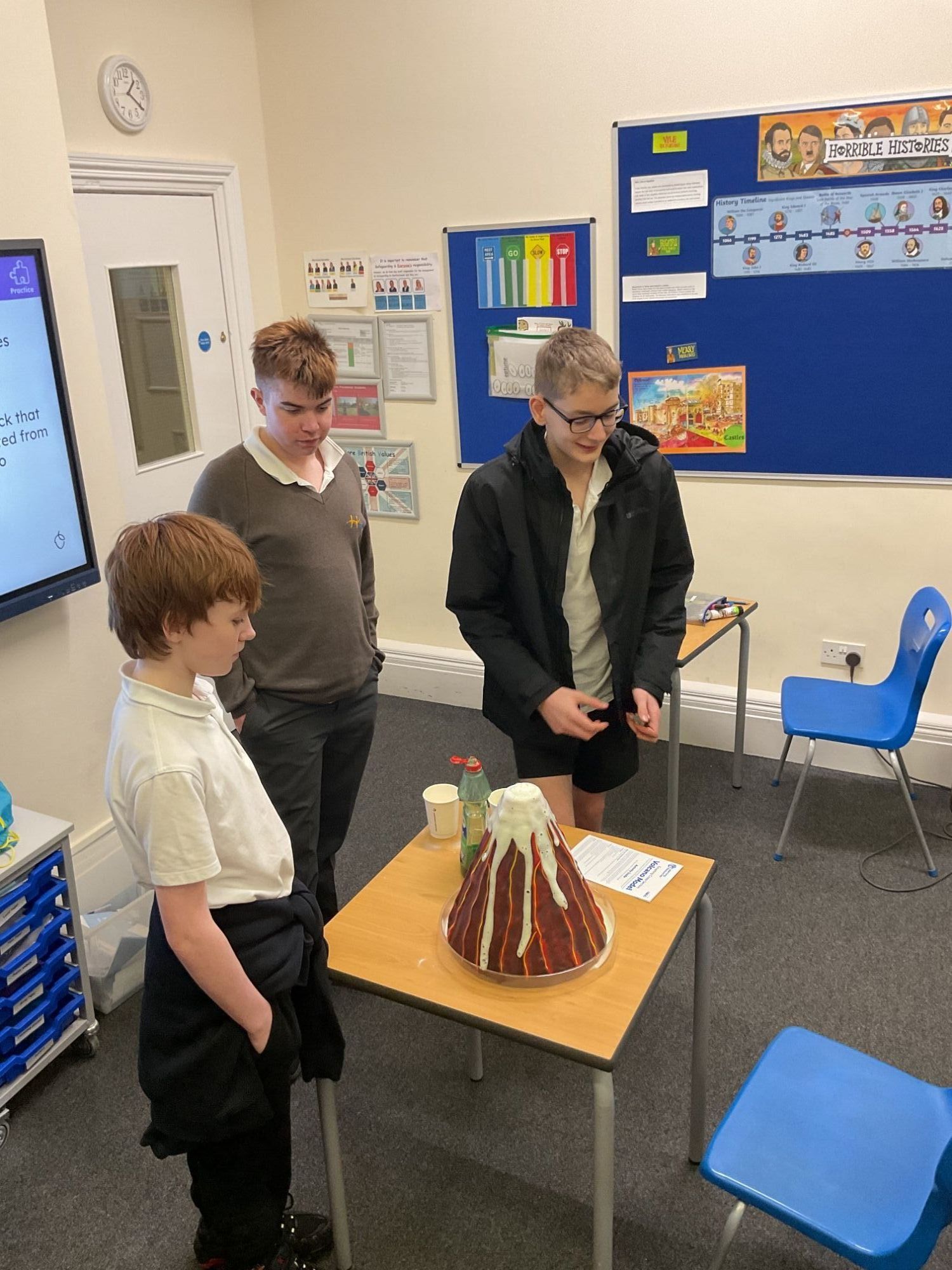Three students with their volcano