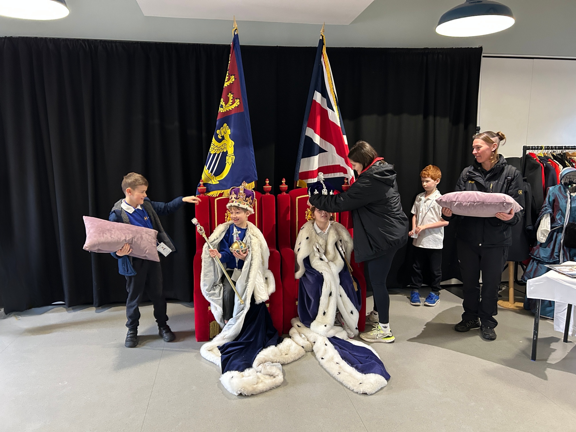 Students and staff acting out a royal scene
