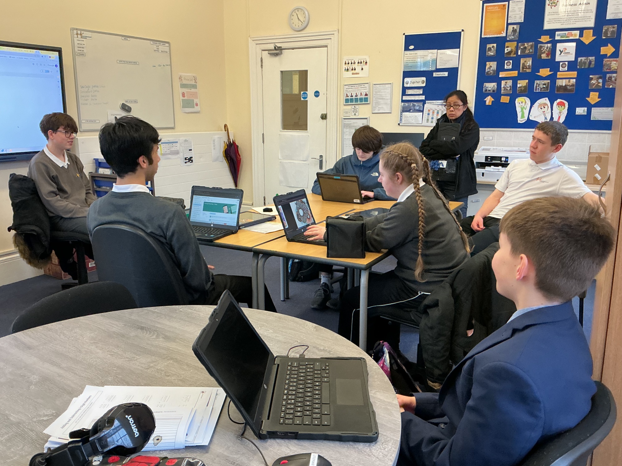Young Enterprise in class holding a board meeting