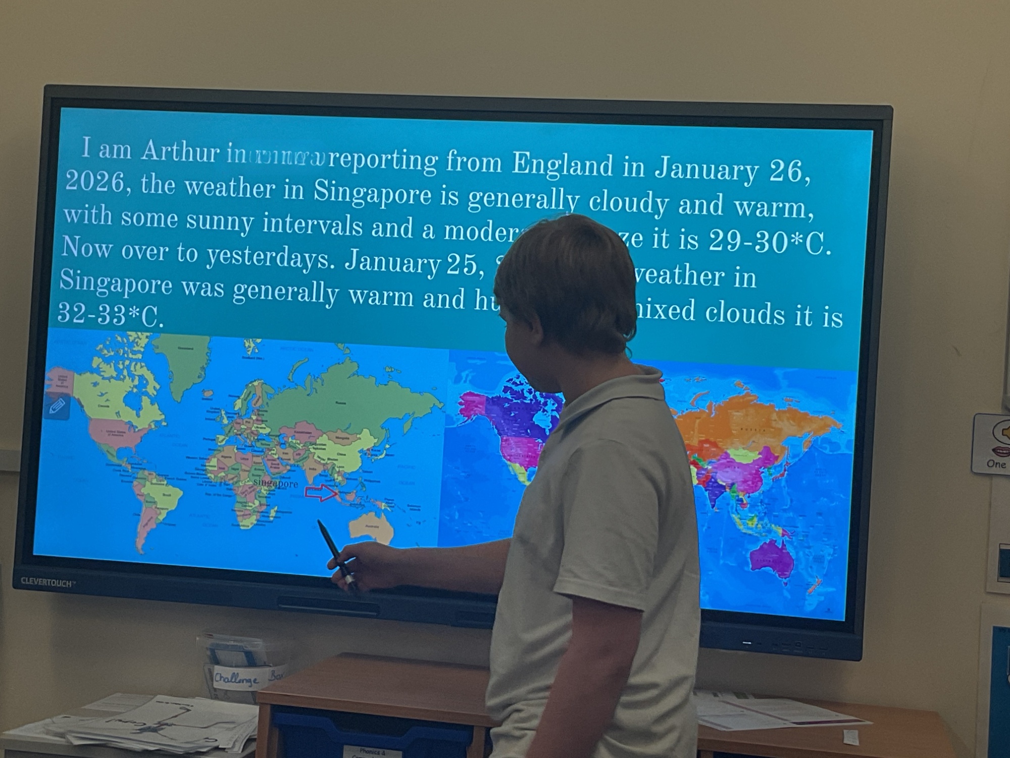 Arthur giving his geography presentation on the class smart board