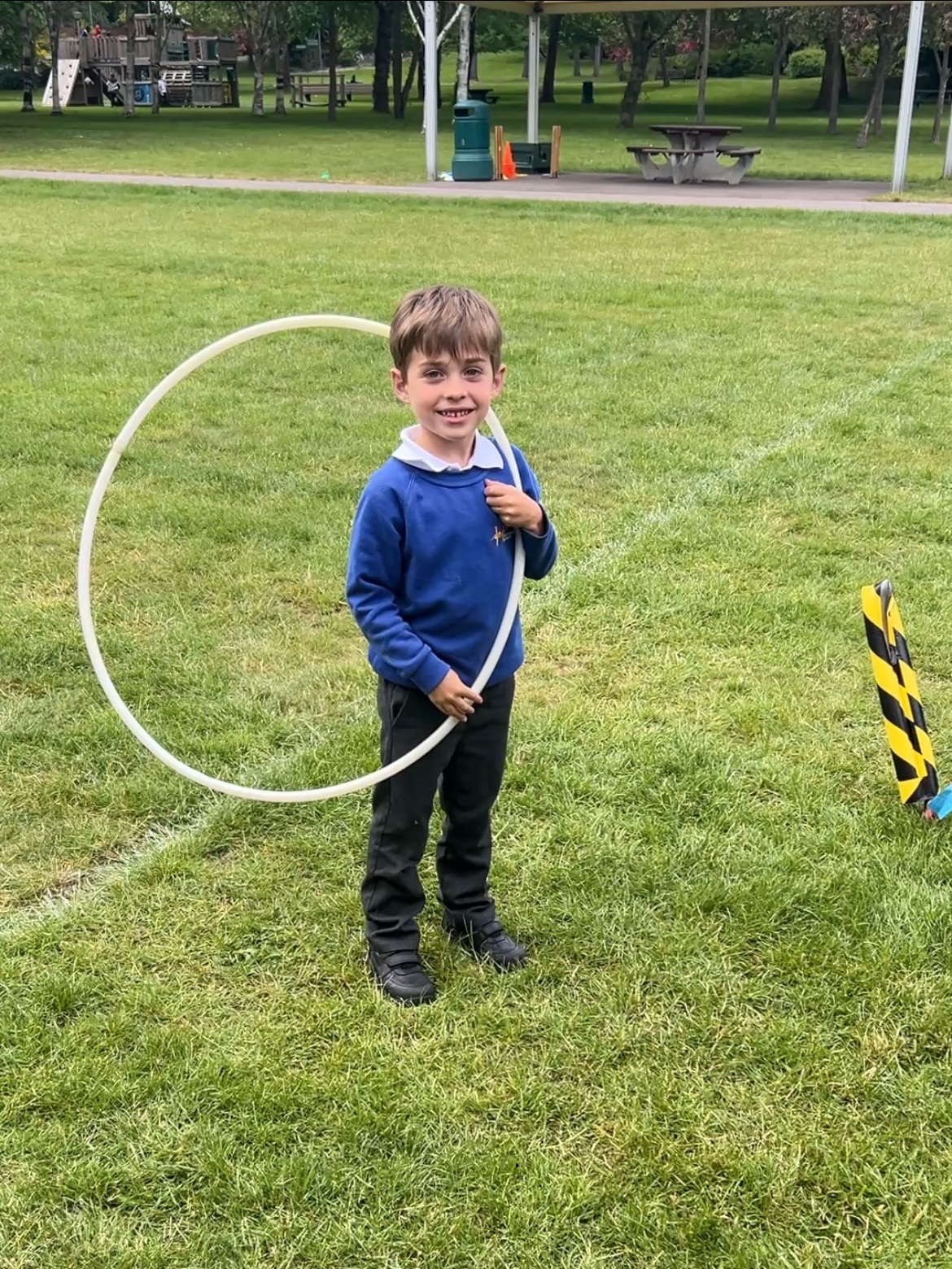 Hula hoop Student learning hula hoop skills on the field