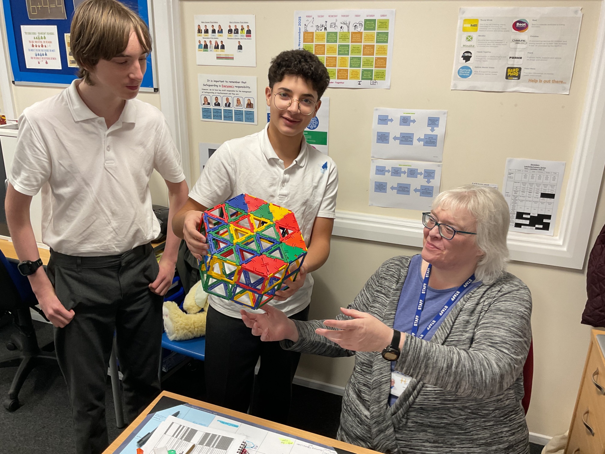 The finished net! Two students show the finished net to the teacher